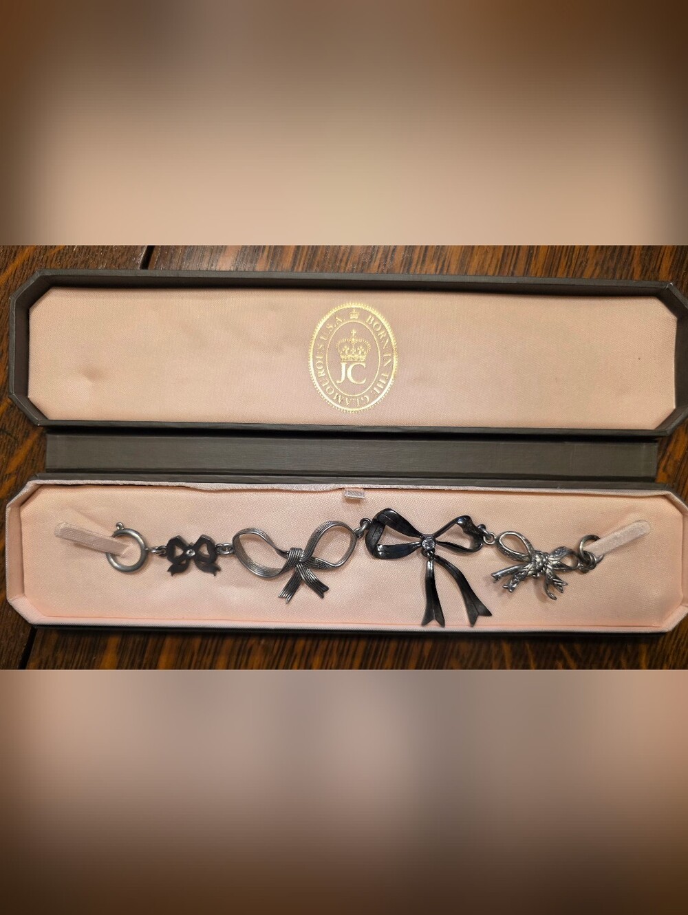 Juicy Couture Bow Charm Bracelet in Gunmetal